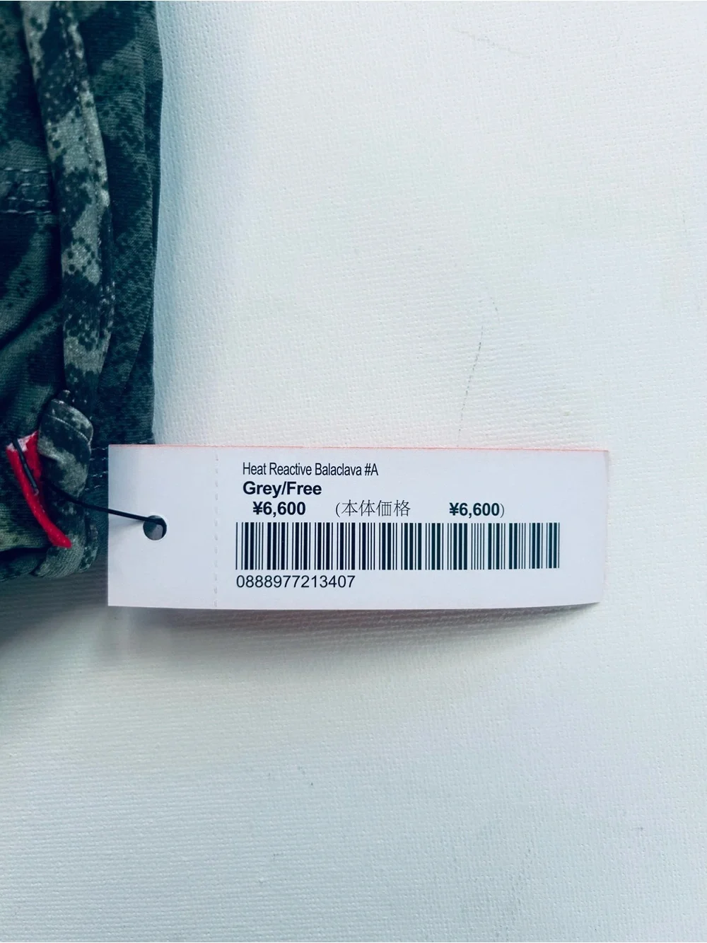 Supreme Black Face Mask with White Logo and Red Tag